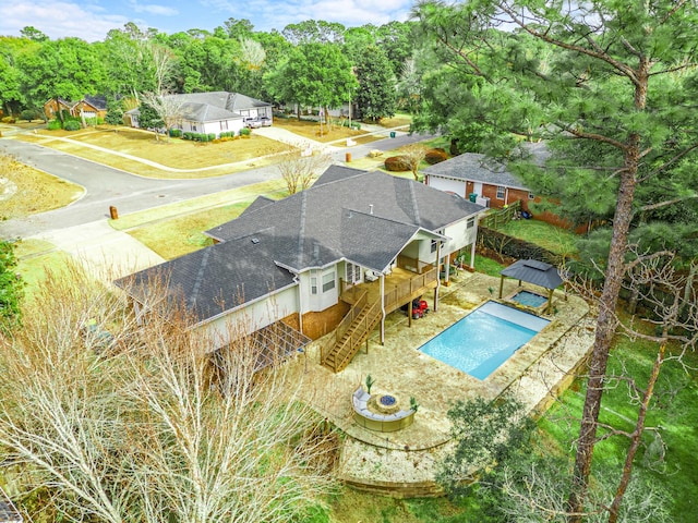 view of swimming pool with a gazebo, an outdoor fire pit, and a deck