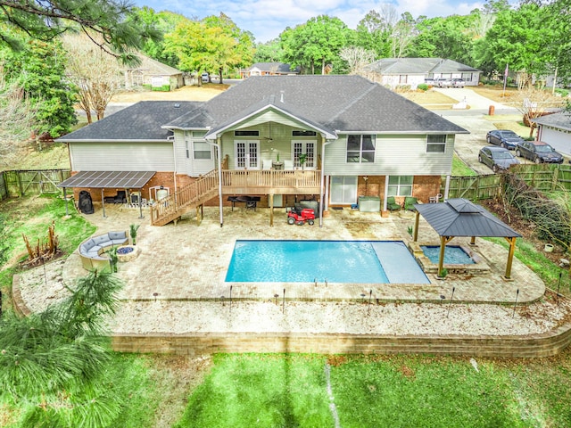 back of property with a pool side deck