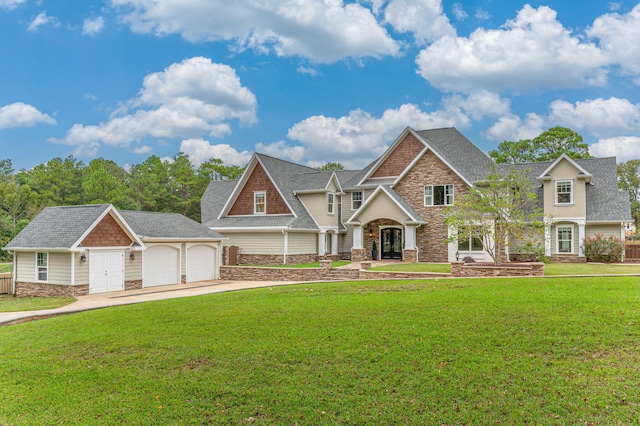 craftsman house featuring a front yard and a garage