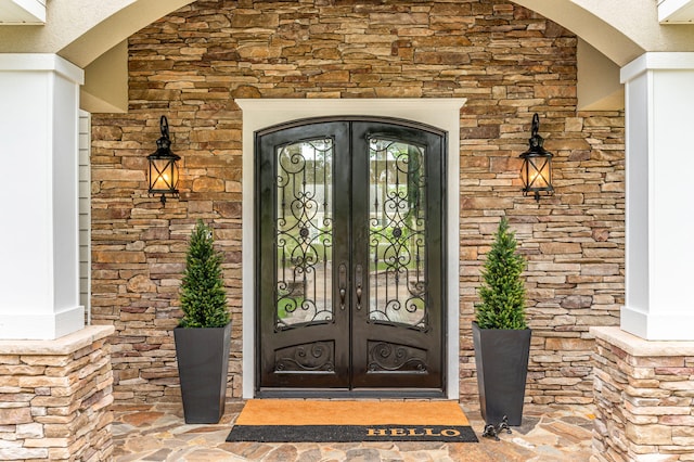 property entrance featuring french doors