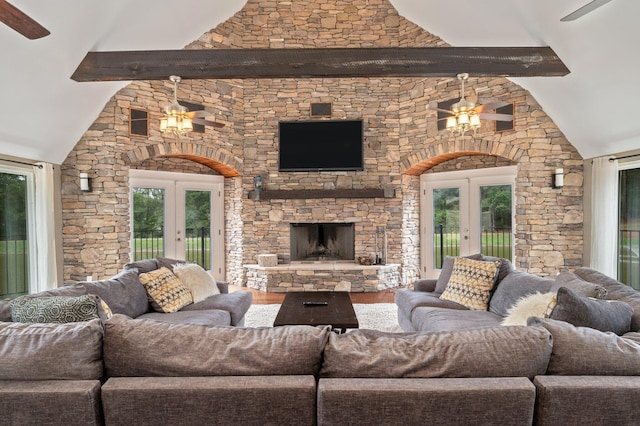 living room with french doors, a fireplace, ceiling fan, and wood-type flooring