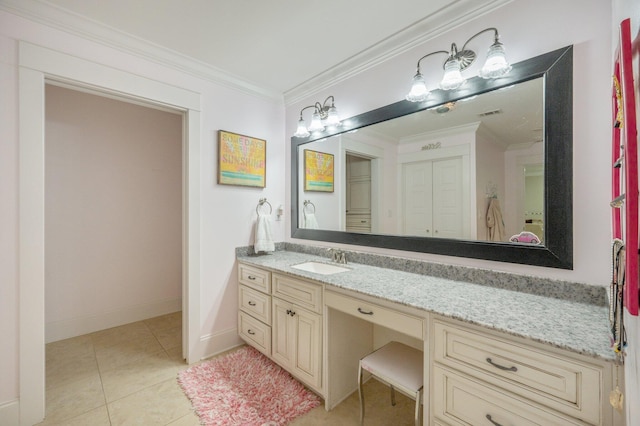 bathroom featuring tile patterned floors, crown molding, and vanity