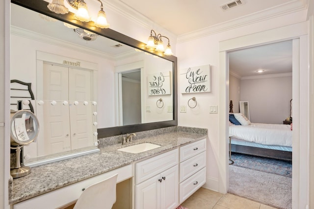 bathroom featuring vanity, tile patterned flooring, and crown molding