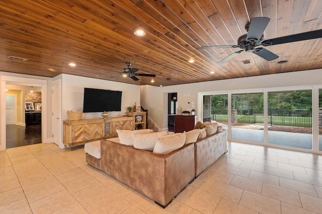 living room with ceiling fan, wooden ceiling, and light tile patterned floors