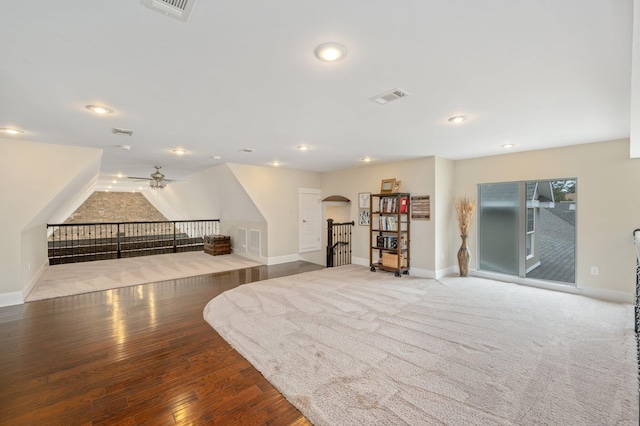 interior space with ceiling fan and hardwood / wood-style flooring