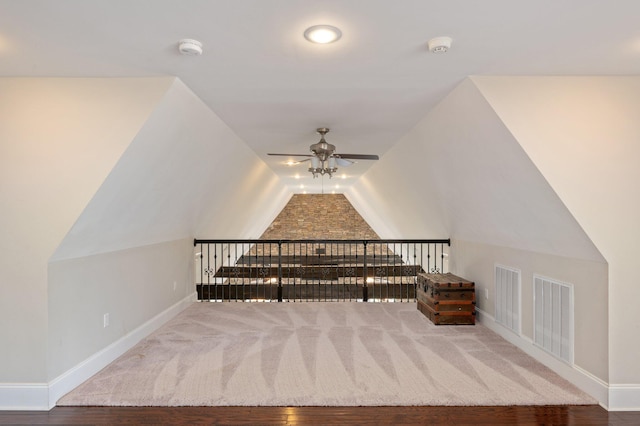 bonus room featuring carpet flooring, ceiling fan, and vaulted ceiling