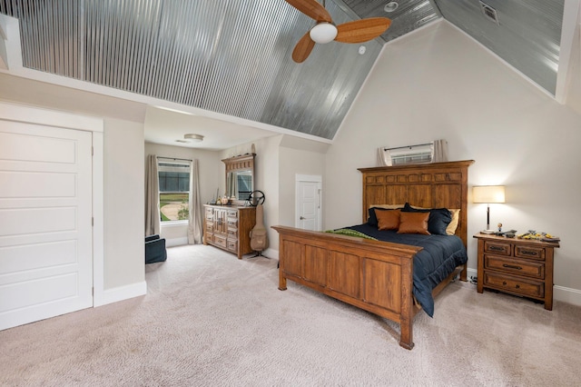 bedroom featuring ceiling fan, high vaulted ceiling, and light carpet