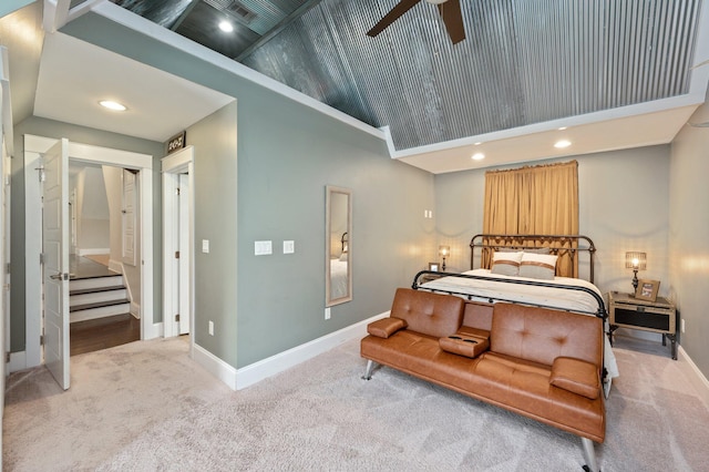 carpeted bedroom with high vaulted ceiling, ceiling fan, and a closet