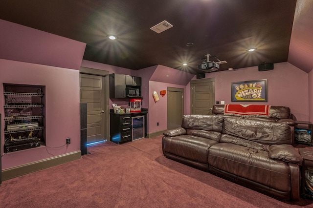 home theater featuring lofted ceiling, dark carpet, and wine cooler