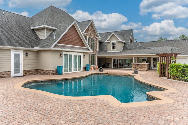 view of pool featuring a patio area and a pergola