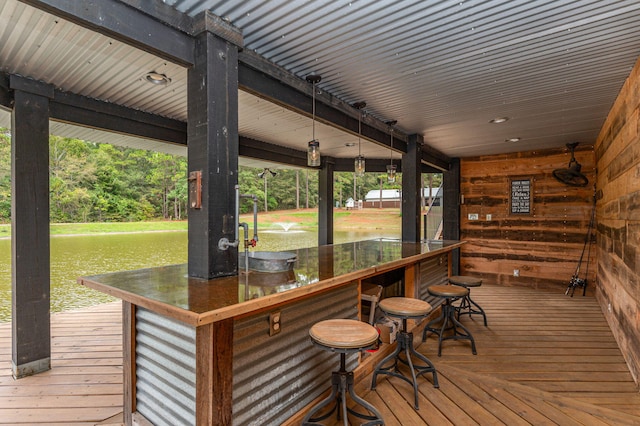 wooden terrace with an outdoor bar