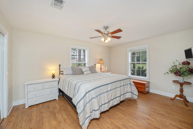 bedroom with ceiling fan and light hardwood / wood-style floors