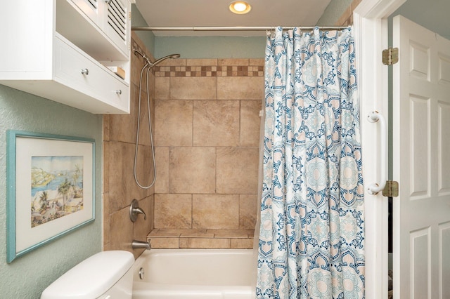 bathroom with shower / bath combination with curtain and toilet