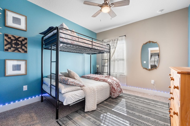 bedroom featuring ceiling fan and carpet flooring