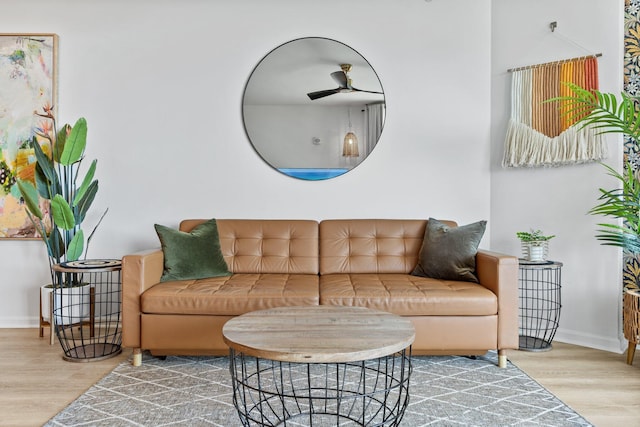 living room with hardwood / wood-style floors and ceiling fan