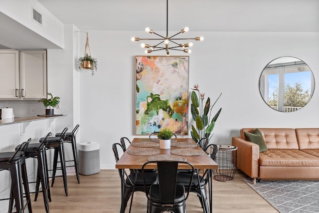 dining area with light hardwood / wood-style floors