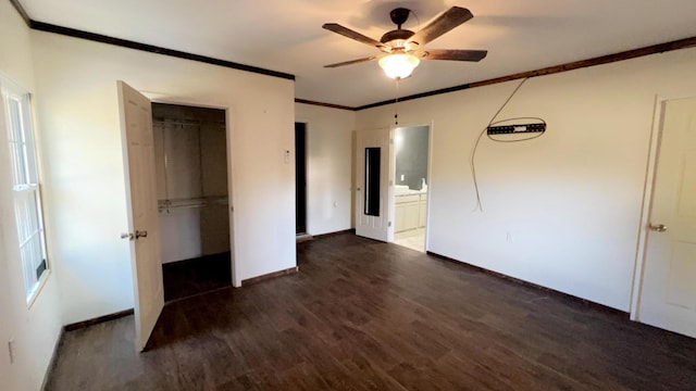 unfurnished bedroom with ceiling fan, dark wood-type flooring, a closet, and crown molding