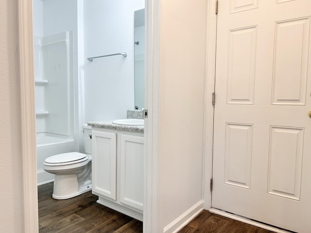 full bathroom with wood-type flooring, toilet, tub / shower combination, and vanity