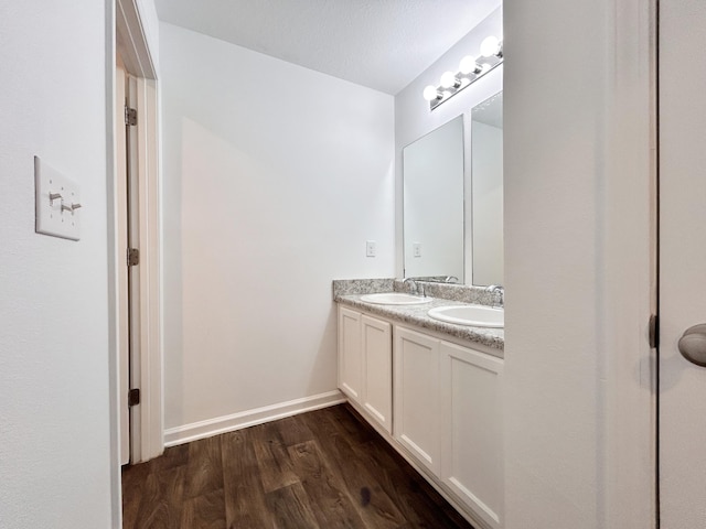 bathroom featuring vanity and hardwood / wood-style floors