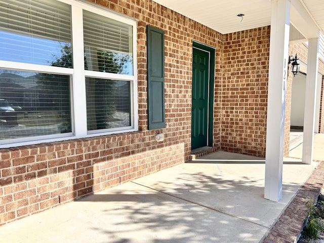 doorway to property with covered porch