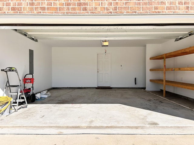 garage featuring a garage door opener and electric panel