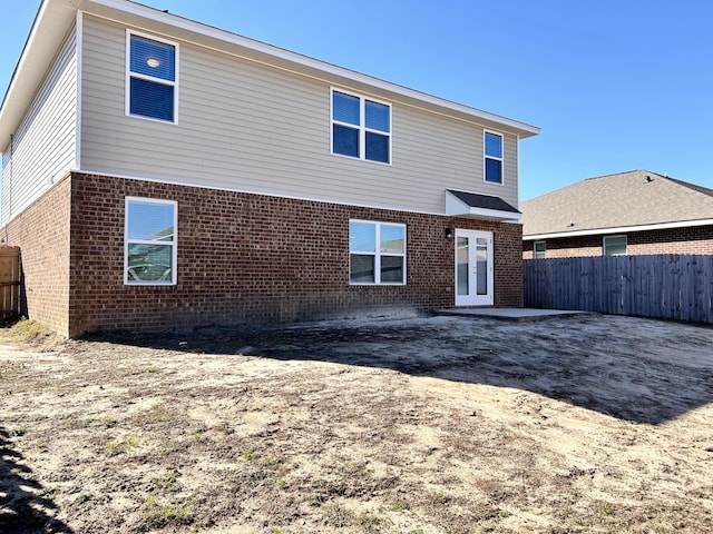 rear view of property featuring french doors and a patio