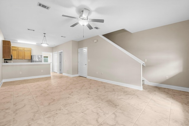 unfurnished living room with ceiling fan