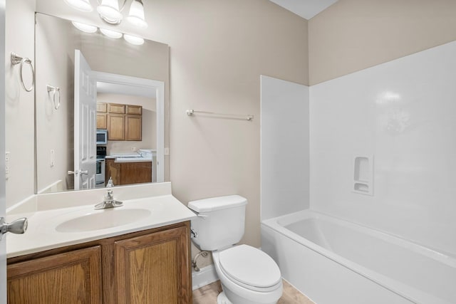 full bathroom featuring toilet, vanity, and shower / bathtub combination