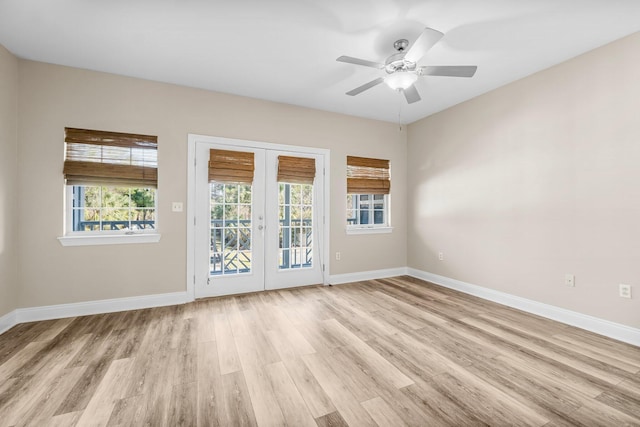 unfurnished room with french doors, ceiling fan, and light hardwood / wood-style floors