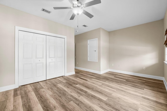 unfurnished bedroom with ceiling fan, light hardwood / wood-style floors, and a closet