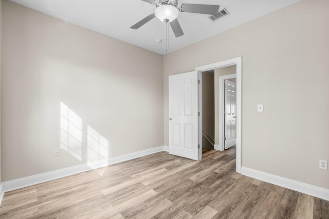 unfurnished room with ceiling fan and light hardwood / wood-style floors