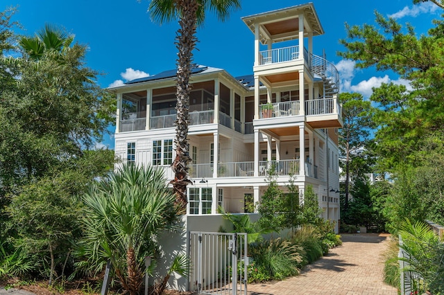 back of property featuring a sunroom