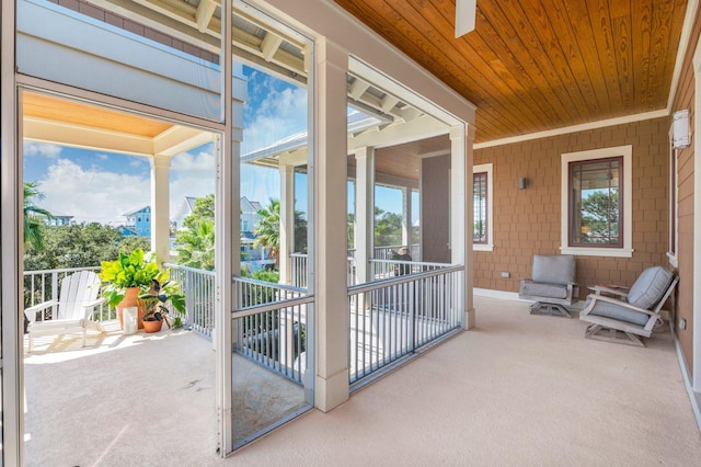 sunroom / solarium with wood ceiling