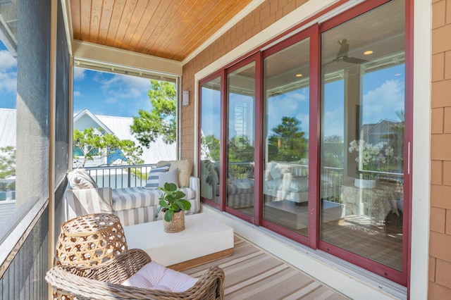 sunroom / solarium featuring wooden ceiling