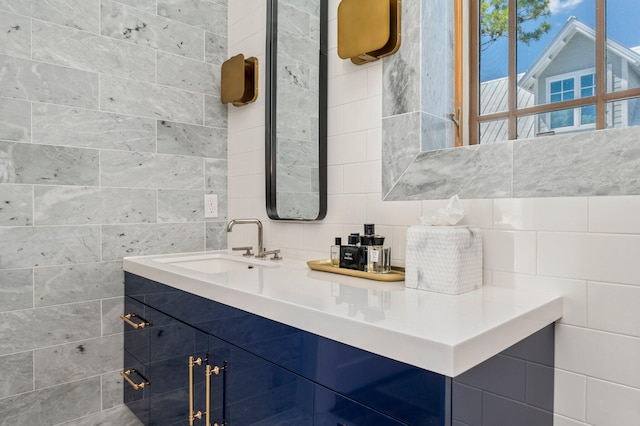 bathroom featuring decorative backsplash and vanity