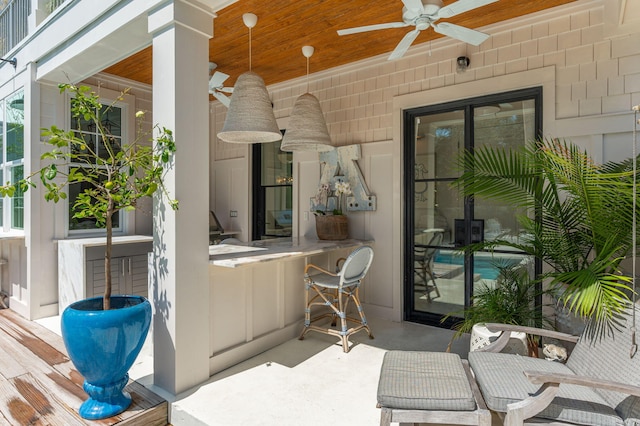 view of patio featuring ceiling fan