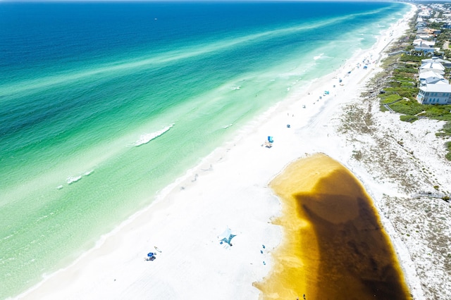 aerial view featuring a view of the beach and a water view