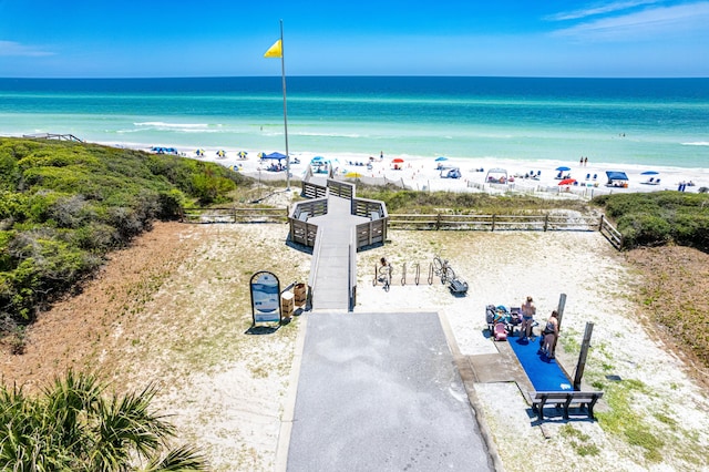 birds eye view of property featuring a view of the beach and a water view