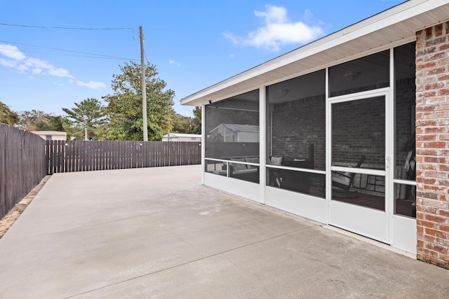 view of patio / terrace with a sunroom