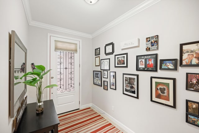 doorway to outside featuring crown molding and carpet