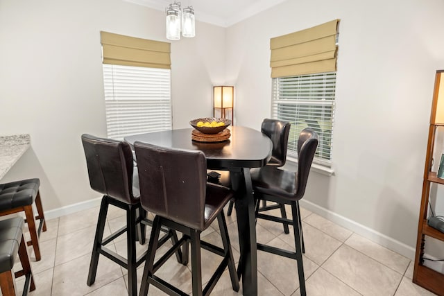 tiled dining space with crown molding