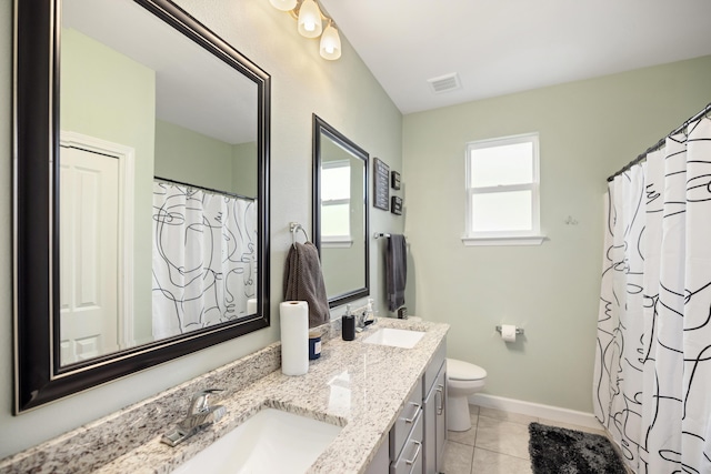 bathroom featuring tile patterned flooring, vanity, a shower with curtain, and toilet