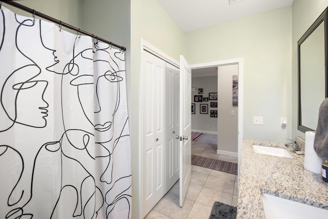 bathroom with vanity and tile patterned flooring