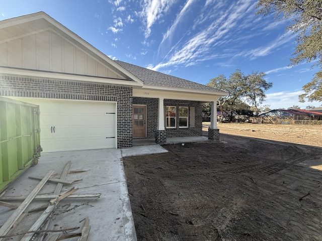 ranch-style house featuring a garage