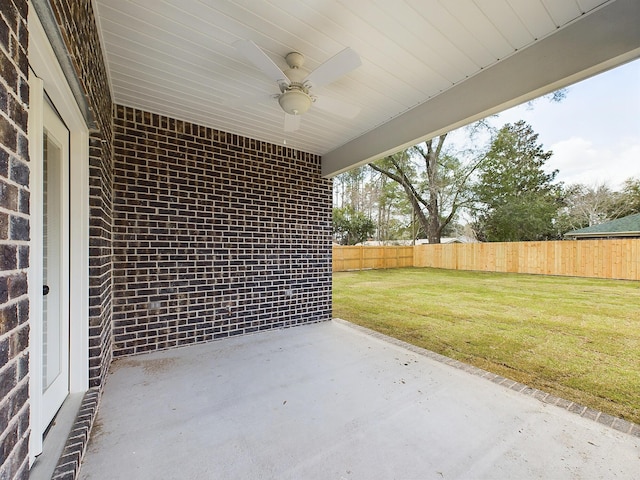 view of patio with a fenced backyard and a ceiling fan