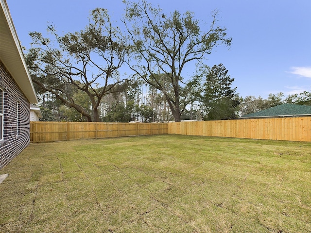 view of yard featuring a fenced backyard