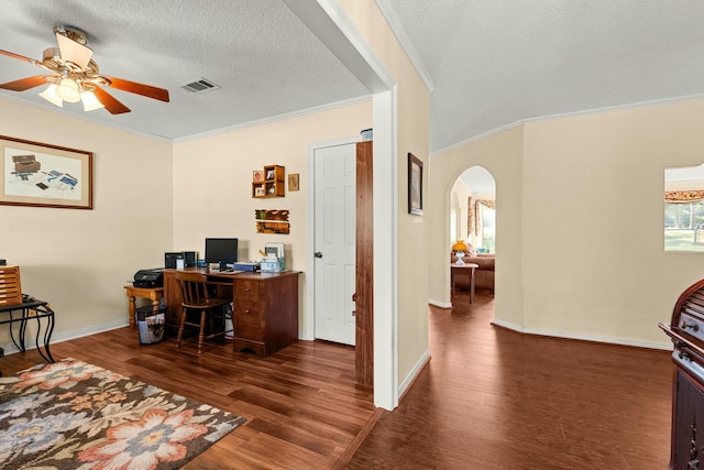 office space featuring a wealth of natural light, a textured ceiling, dark hardwood / wood-style floors, and crown molding