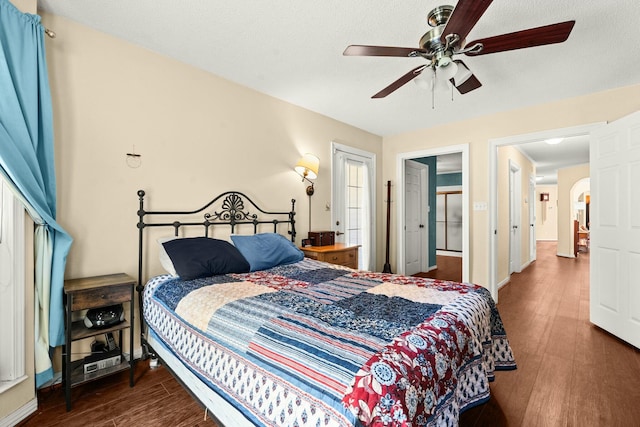 bedroom featuring ceiling fan and dark hardwood / wood-style flooring