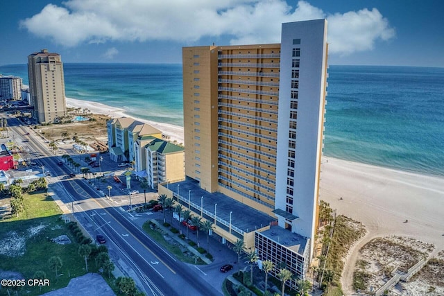 bird's eye view with a beach view and a water view