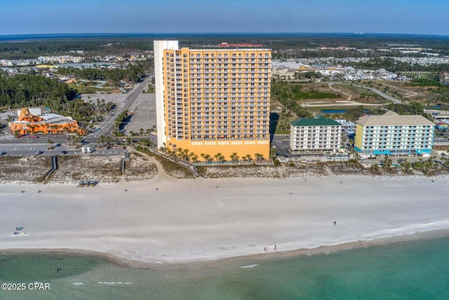 birds eye view of property with a view of the beach and a water view